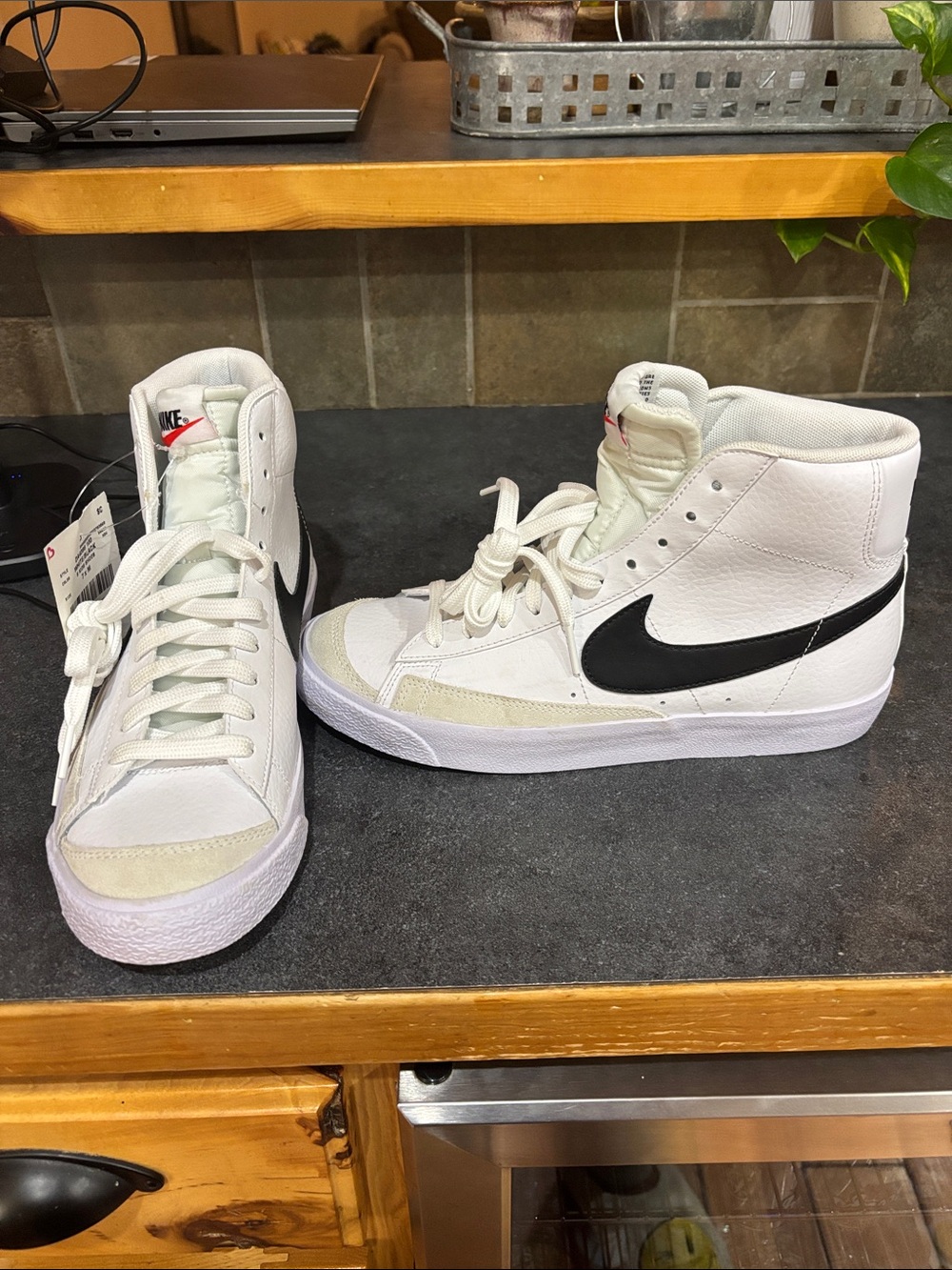 Nike High-Top Sneakers in White with Black Swoosh